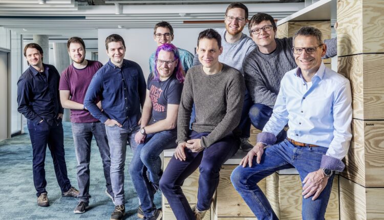 Jürgen Peters (centre), Head of Software Development at Arburg, with his Innovation Hub team in Karlsruhe. More IT and software experts are always welcome at Arburg.